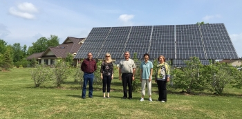 Six photovoltaic arrays generate 32 kilowatts of energy to power 20 units at the Akwesasne Housing Authorityâs (AHA) Sunrise Acres housing complex on the St. Regis Mohawk Reservation. Pictured from left to right are Paul Kabotie of Indigenous Collaboration, Inc., Rachel Sullivan of the National Renewable Energy Laboratory, Cecil Ransom of AHA, Sandra Begay-Campbell of Sandia National Laboratories, and Sheila Loran of AHA. Photo from Lesley Kabotie, Indigenous Collaboration, Inc. Six photovoltaic arrays generate 32 kilowatts of energy to power 20 units at the Akwesasne Housing Authorityâs (AHA) Sunrise Acres housing complex on the St. Regis Mohawk Reservation. Pictured from left to right are Paul Kabotie of Indigenous Collaboration, Inc., Rachel Sullivan of the National Renewable Energy Laboratory, Cecil Ransom of AHA, Sandra Begay-Campbell of Sandia National Laboratories, and Sheila Loran of AHA. Photo from Lesley Kabotie, Indigenous Collaboration, Inc.