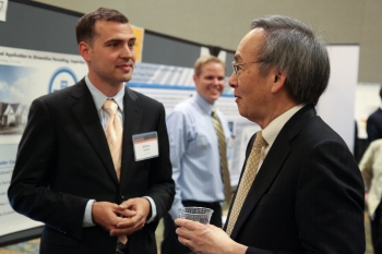 William Parish from Solar Mosaic, one of nine solar startups chosen for the latest round of SunShot Incubator funding, discusses his companyâs project with Energy Secretary Steven Chu at the SunShot Grand Challenge Summit in Denver, Colorado. | Photo by John De La Rosa. William Parish from Solar Mosaic, one of nine solar startups chosen for the latest round of SunShot Incubator funding, discusses his companyâs project with Energy Secretary Steven Chu at the SunShot Grand Challenge Summit in Denver, Colorado. | Photo by John De La Rosa.