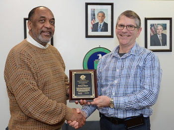 Richard Mayer, right, is pictured with Portsmouth Site Director Dr. Vincent Adams with a plaque commemorating Mayerâs accomplishment. Richard Mayer, right, is pictured with Portsmouth Site Director Dr. Vincent Adams with a plaque commemorating Mayerâs accomplishment.