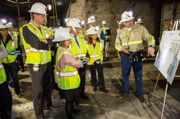 Nuclear Waste Partnership Deputy Manager of Underground Operations Mark Pearcy describes airflow in the WIPP underground to Sen. Martin Heinrich, from left, Rep. Michelle Lujan Grisham, Energy Secretary Ernest Moniz and EM Assistant Secretary Monica Regalbuto. The underground tour was part of a Jan. 9 event for WIPP's reopening. Nuclear Waste Partnership Deputy Manager of Underground Operations Mark Pearcy describes airflow in the WIPP underground to Sen. Martin Heinrich, from left, Rep. Michelle Lujan Grisham, Energy Secretary Ernest Moniz and EM Assistant Secretary Monica Regalbuto. The underground tour was part of a Jan. 9 event for WIPP's reopening.