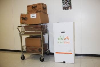 Adam Sieminski, who works in the Energy Information Administration (EIA), brought in boxes of food for the Feds Feed Families Drive. "The boxes were not really full of Twix bars," Sieminski said. "The cans of soup, fruits and vegetables should help provide a healthy meal for some families in need." | Photo courtesy of Adam Sieminski. Adam Sieminski, who works in the Energy Information Administration (EIA), brought in boxes of food for the Feds Feed Families Drive. "The boxes were not really full of Twix bars," Sieminski said. "The cans of soup, fruits and vegetables should help provide a healthy meal for some families in need." | Photo courtesy of Adam Sieminski.