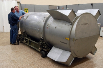 Two Pantex Plant employees examine the final B53 bomb prior to its dismantling. | Photo Courtesy of <a href="http://www.flickr.com/photos/nnsanews/sets/72157627937731182/">NNSA</a>. Two Pantex Plant employees examine the final B53 bomb prior to its dismantling. | Photo Courtesy of <a href="http://www.flickr.com/photos/nnsanews/sets/72157627937731182/">NNSA</a>.