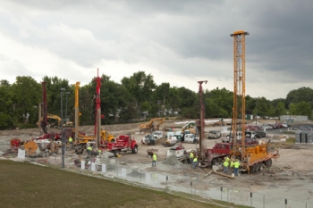 Workers drill boreholes for a geothermal heating and cooling system at Ball State Universityâs campus in Muncie, Ind. | Photo courtesy of Ball State University Workers drill boreholes for a geothermal heating and cooling system at Ball State Universityâs campus in Muncie, Ind. | Photo courtesy of Ball State University