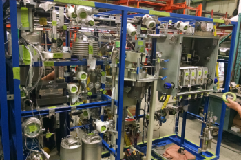 The main section of the Novomer system which includes a reactor, membrane separation, polymerizer, and controls needed to run the fully automated system which converts waste carbon dioxide into valuable chemicals. The main section of the Novomer system which includes a reactor, membrane separation, polymerizer, and controls needed to run the fully automated system which converts waste carbon dioxide into valuable chemicals.