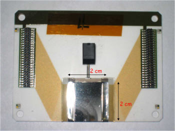 A detailed view of the diamond wafers scientists use to get a better measure of spinning electrons. | Photo courtesy of Jefferson Lab. A detailed view of the diamond wafers scientists use to get a better measure of spinning electrons. | Photo courtesy of Jefferson Lab.