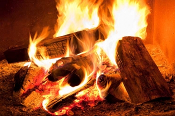 A warm fireplace can save you energy and money with proper maintenance. | Photo courtesy of ©iStockphoto.com/Pgiam.
A warm fireplace can save you energy and money with proper maintenance. | Photo courtesy of ©iStockphoto.com/Pgiam.