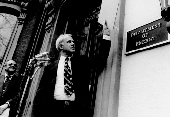 Dr. James R. Schlesinger, the first Secretary of Energy, unveils the signplate at the Energy Department's temporary headquarters on October 1, 1977. Dr. James R. Schlesinger, the first Secretary of Energy, unveils the signplate at the Energy Department's temporary headquarters on October 1, 1977.