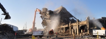 Workers tear down the remaining structure of the K-25 North End this morning. Workers tear down the remaining structure of the K-25 North End this morning.