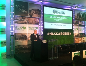 Dr. Michael Knotek, Deputy Undersecretary for Science and Energy at the Energy Department, delivers remarks at the NASCAR Green Summit in Chicago, where the DOE-NASCAR MOU was announced. | Photo courtesy of NASCAR. Dr. Michael Knotek, Deputy Undersecretary for Science and Energy at the Energy Department, delivers remarks at the NASCAR Green Summit in Chicago, where the DOE-NASCAR MOU was announced. | Photo courtesy of NASCAR.