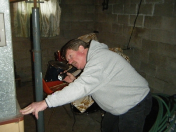 Mark Morris inspects a furnace. | File photo Mark Morris inspects a furnace. | File photo