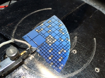 III-V/Si multi-junction solar cells developed at Ohio State University undergo illuminated current-voltage testing. III-V/Si multi-junction solar cells developed at Ohio State University undergo illuminated current-voltage testing.