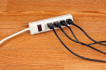 Using a power strip to turn off electronics and appliances when they aren't in use ensures that they are truly off and not using extra electricity. | Photo courtesy of ©iStockphoto.com/DonNichols. Using a power strip to turn off electronics and appliances when they aren't in use ensures that they are truly off and not using extra electricity. | Photo courtesy of ©iStockphoto.com/DonNichols.