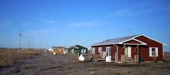A row of homes on the Pine Ridge Reservation in South Dakota. A row of homes on the Pine Ridge Reservation in South Dakota.