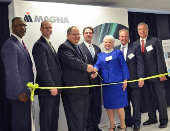 Vehicle Technologies Program Manager Patrick B. Davis gets ready to cut the ribbon at Magna E-Car's new electric drive component plant in Michigan. From left: Mike Finney - CEO, Michigan Economic Development Corporation; Gary Meyers - VP/General Manager, Magna E-Car USA, LP; Pat Davis; Kevin Pavlov - Chief Operating Officer, Magna E-Car Systems; Marilyn Hoffman, Township Supervisor, Grand Blanc Township, Michigan; Joseph Graves, State Representative 51st District, Michigan House of Representatives; Tim Herman, CEO, The Genesee County Chamber of Commerce. | Photo courtesy of Magna E-Car. Vehicle Technologies Program Manager Patrick B. Davis gets ready to cut the ribbon at Magna E-Car's new electric drive component plant in Michigan. From left: Mike Finney - CEO, Michigan Economic Development Corporation; Gary Meyers - VP/General Manager, Magna E-Car USA, LP; Pat Davis; Kevin Pavlov - Chief Operating Officer, Magna E-Car Systems; Marilyn Hoffman, Township Supervisor, Grand Blanc Township, Michigan; Joseph Graves, State Representative 51st District, Michigan House of Representatives; Tim Herman, CEO, The Genesee County Chamber of Commerce. | Photo courtesy of Magna E-Car.