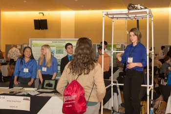 A student team from Issaquah, Washington, demonstrate their idea for an energy-saving shower at the Imagine Tomorrow competition last month. | Energy Department photo A student team from Issaquah, Washington, demonstrate their idea for an energy-saving shower at the Imagine Tomorrow competition last month. | Energy Department photo