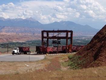 One of two gantry cranes that load and unload tailings containers from the railcars is pictured on the hillside rail bench west of Moab One of two gantry cranes that load and unload tailings containers from the railcars is pictured on the hillside rail bench west of Moab