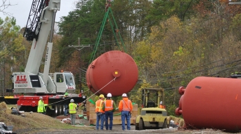 Workers safely remove old mercury tanks from the Y-12 National Security Complex. Workers safely remove old mercury tanks from the Y-12 National Security Complex.