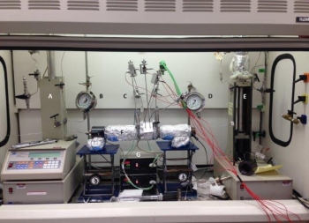 Laboratory-scale stimulation system with acoustic emission sensing for real-time monitoring of fracking processes featuring:
A & E-ISCO pumps that apply and control confining pressure around rock sample F and deliver racking fluids inside a rock sample void; B & D-manometers that monitor confining pressure and fracking fluid pressure; C-acoustic emissions sensors for real-time monitoring of fracture creating/propagation; F-EGS-type rock sample; and G-controllers that maintain constant temperature up to 400°C. Source: Dr. Carlos Fernandez, PNNL. Laboratory-scale stimulation system with acoustic emission sensing for real-time monitoring of fracking processes featuring:
A & E-ISCO pumps that apply and control confining pressure around rock sample F and deliver racking fluids inside a rock sample void; B & D-manometers that monitor confining pressure and fracking fluid pressure; C-acoustic emissions sensors for real-time monitoring of fracture creating/propagation; F-EGS-type rock sample; and G-controllers that maintain constant temperature up to 400°C. Source: Dr. Carlos Fernandez, PNNL.