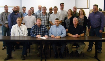 Officials from Portsmouth/Paducah Project Office and Portsmouth Mission Alliance gather to sign the partnering agreement.