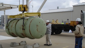 Mid-America Conversion Services workers move a Depleted Uranium Hexafluoride storage cylinder at the Paducah plant.