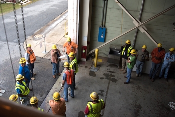 Savannah River Remediation employees participate in a safety briefing before starting work.