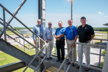In a tour of the SRS Saltstone Facilities, Jarrell, center, gathers with SRS officials atop the silos overlooking an area with the Saltstone vaults and the newly-completed Saltstone Disposal Unit (SDU) 6.