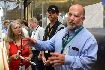 During his Oak Ridge visit, Jarrell, right, toured all EM-related projects and facilities, including the Transuranic Waste Processing Center. He met the employees who are processing and packaging waste for disposal at the WIPP near Carlsbad, New Mexico.