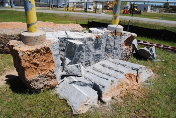 A demonstration of the expanding grout method to break up the concrete surrounding the underground transfer lines, which protected the adjacent waste lines from the shock of traditional demolition methods.