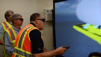 John Bobbitt of Savannah River National Laboratory (center) and Greg Meyer of Fluor work through a demonstration of training program designed to improve workersâ and managersâ abilities to safely perform segmentation and other work.