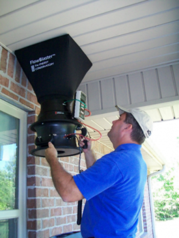 Photo of a man measuring outdoor air flow.