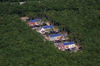 aerial shots of homes with solar panels on their roof.