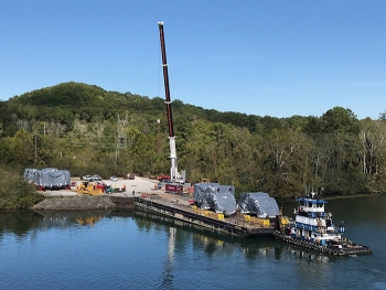 UniTech equipment transported from Michigan is unloaded at the barge access area at the East Tennessee Technology Park.