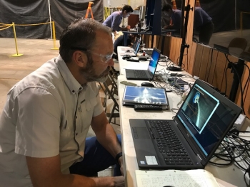Fluor Idaho Calcine Retrieval Project Manager Howard Forsythe observes the robotic snake arm during a recent demonstration inside a mockup of a calcine bin.