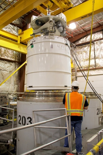A Fluor Idaho employee loads a container with 10 55-gallon drums inside a TRUPACT-II shipping vessel at the Advanced Mixed Waste Treatment Project.