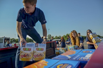 Fluor Federal Services interns drop off the Paducah Siteâs donated food for the 2017 Feds Feed Families food drive.