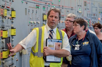 EM Paducah Site Safety Systems Oversight/General Engineer Brad Pont leads Atomic Energy Workers Council members through the C-300 Building.