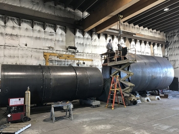EMâs Idaho Site cleanup contractor Fluor Idaho worked with small business Diversified Metal Products to fabricate a full-scale mockup of a waste storage bin for testing.