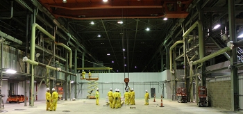 Geiger Brothers, a Historically Underutilized Business Zone small business, supports Portsmouth Site deactivation activities in a large process building housing uranium enrichment equipment. Here, Geiger crews work in the siteâs X-333 Process Building.