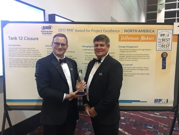 Savannah River Remediation (SRR) Chief Operating Officer Mark Schmitz, left, and SRR President and Project Manager Tom Foster accept the Award for Project Excellence at the Project Management Instituteâs Global Project Management Conference in Chicago.