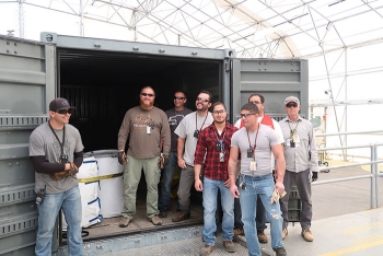 Team members celebrated the final shipment of RNS drums to WCRRF.