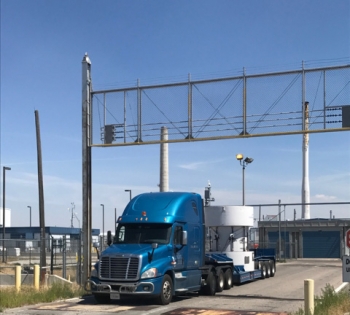 A new 50,000-pound cask carrying low-level waste leaves the Idaho Site en route to an offsite disposal site.