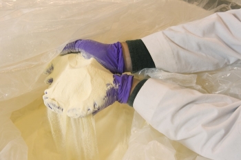 Sodium lactate, a food additive, is used to stimulate microorganisms in the aquifer.