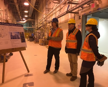 Under Secretary Paul Dabbar, (middle) and Chief of Staff Kristen Ellis (right) are briefed by Office of River Protection Assistant Manager for the WTP Bill Hamel at the WTP Analytical Laboratory.