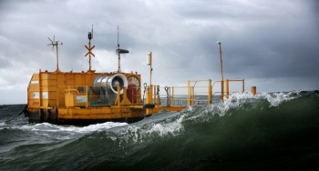 A yellow oscillating water column in turbulent waters.