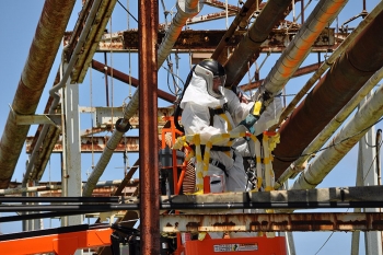 Crews deactivate the Central Neutralization Facility by disabling utilities and cutting tie lines.