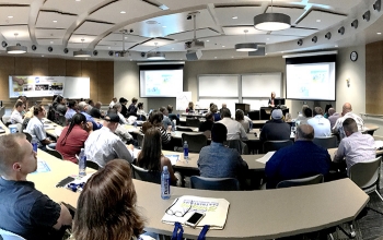 Washington River Protection Solutions (WRPS) procurement representatives present to approximately 60 business representatives at a Meet the Buyer program in Pasco, Wash.