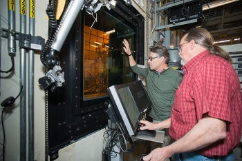 Dan Iverson (right), melter engineer with Savannah River Remediation, the Savannah River Site's liquid waste contractor, explains melter operations to Energy Secretary Rick Perry at the Defense Waste Processing Facility.