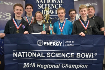 The Lone Oak Middle School winning team (left to right): Jack Perriello, Reese Bell, EM Paducah Site Lead Jennifer Woodard of EMâs Portsmouth/Paducah Project Office, Isaac Reynolds, Avery Miller, Cameron Willis, and coach Daniel Rushing.