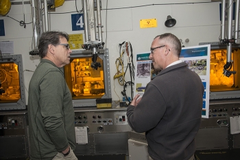 Energy Secretary Rick Perry learns more about the Mark-18a program from Bill Bates, Savannah River National Laboratory Deputy Associate Lab Director for Nuclear Materials Management Programs.