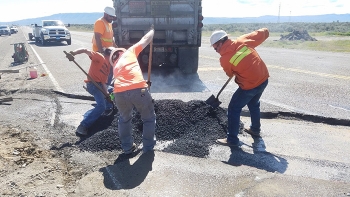 Workers from local small business Watts Construction provide critical road maintenance across the Hanford Site.